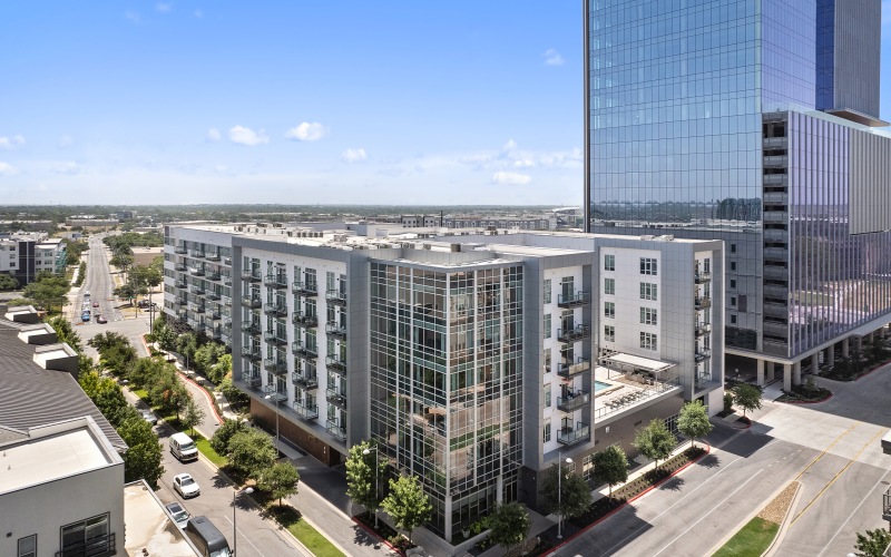 Find your perfect fit at The Grand at the Domain Exterior of Building with surrounding neighborhood
