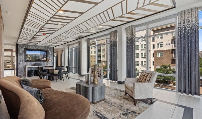 Residential Clubhouse with Lounge Seating and large floor to ceiling windows