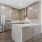 Overview of kitchen with brown cabinets and stainless steel appliances