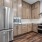 Overview of kitchen with brown cabinets and stainless steel appliances
