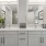Bathroom with white cabinets, double vanity sinks