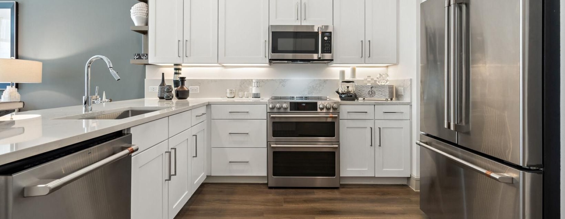 a kitchen with white cabinets