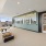 a room with a large window and a large carpeted floor