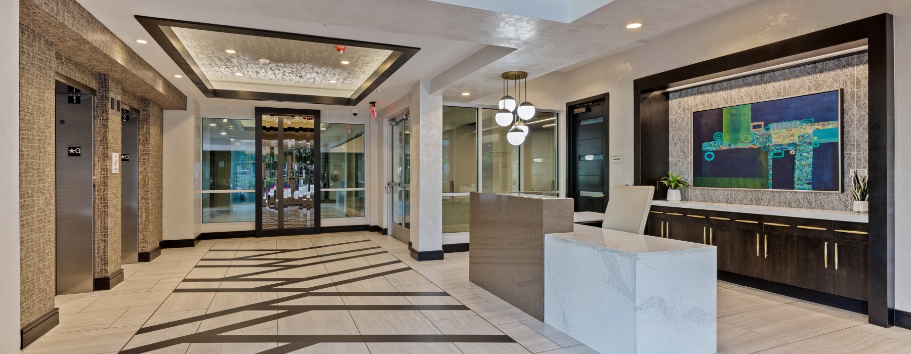 Leasing Office with concierge desk and two elevators