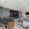 Lounge area with a poker table, tv's and lounge seating