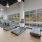a room with exercise equipment and windows