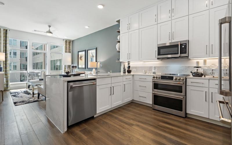 a kitchen with white cabinets