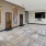 a large living room with a large painting on the wall